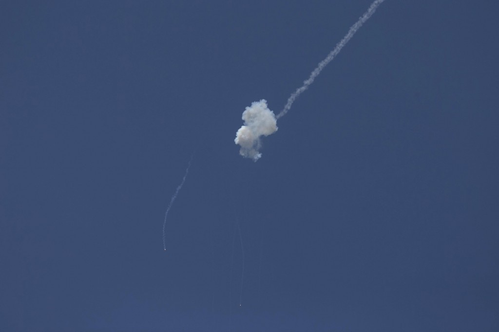 A rocket fired by Palestinian terrorists in Gaza is intercepted by the Iron Dome anti-missile system near the southern town of Sderot