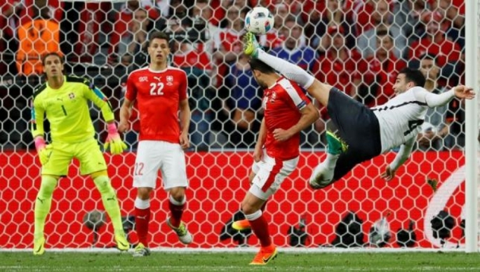 France's Adil Rami fouls Switzerland's Admir Mehmedi resulting in a yellow card