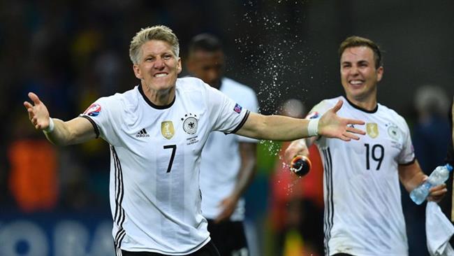 Germany's midfielder Bastian Schweinsteiger celebrates with teammates after scoring a goal during the Euro 2016 group C football match between Germany and Ukraine at the Stade Pierre Mauroy in Villeneuve-d'Ascq near Lille