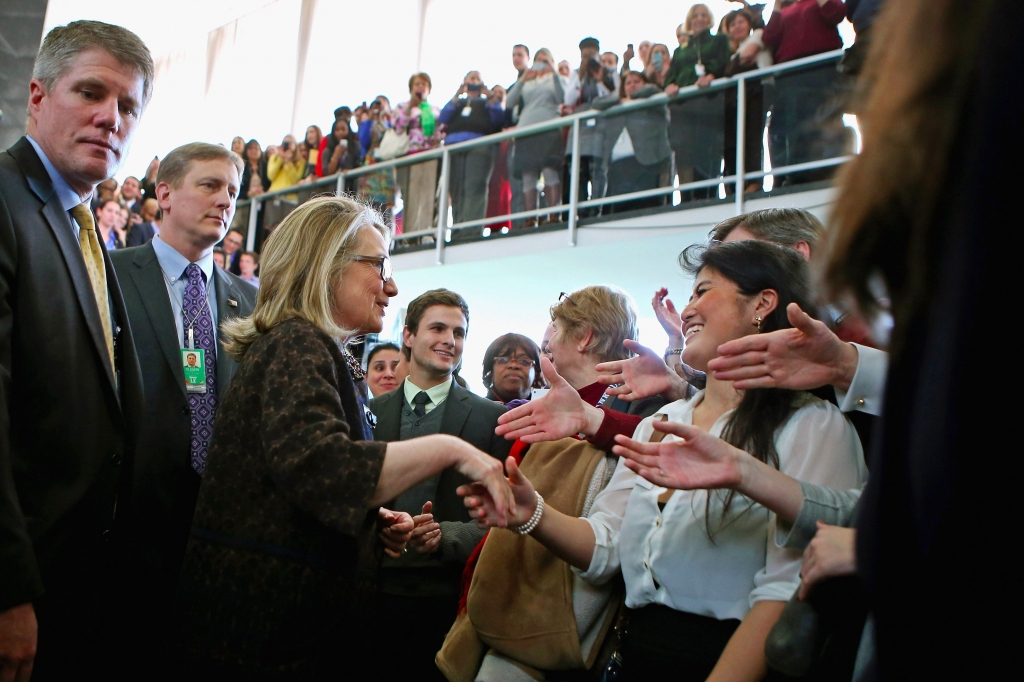 Hillary Clinton shakes hands with people