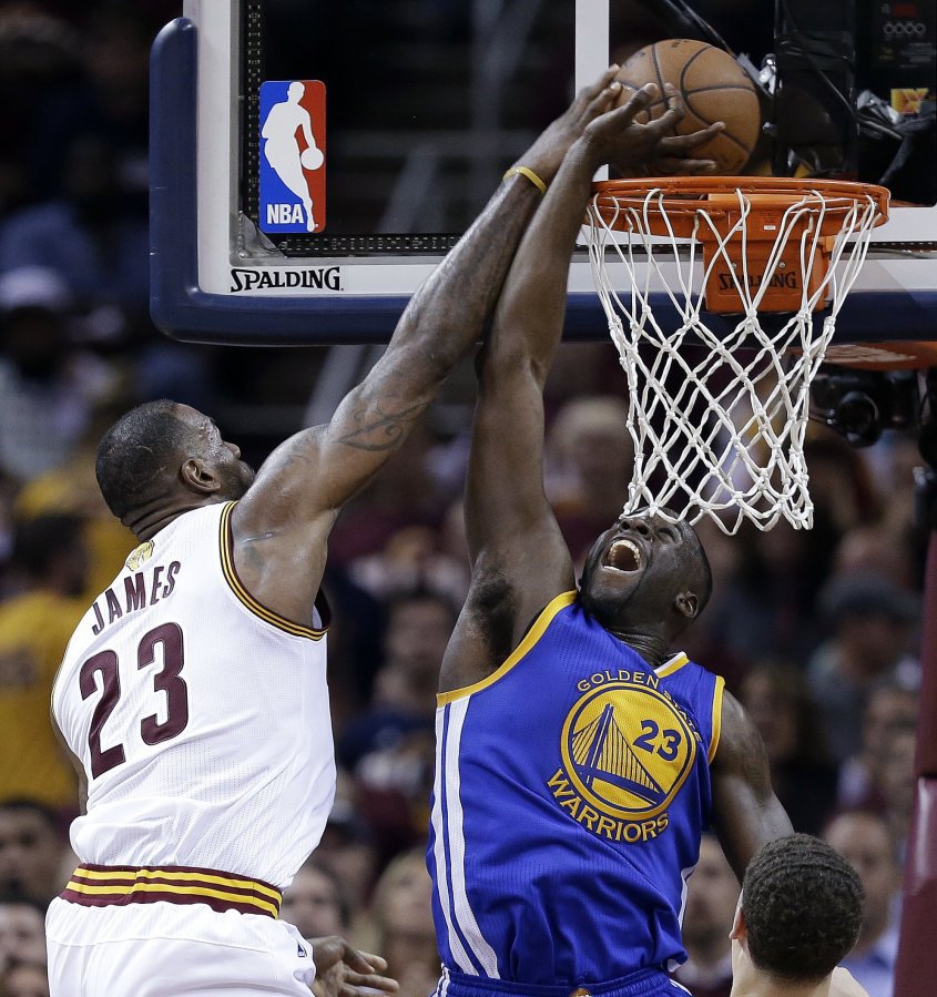 Associated Press Cavaliers forward Le Bron James drives on Warriors forward Draymond Green on Wednesday during Game 3 of the NBA Finals on Wednesday. James scored 32 points in the win