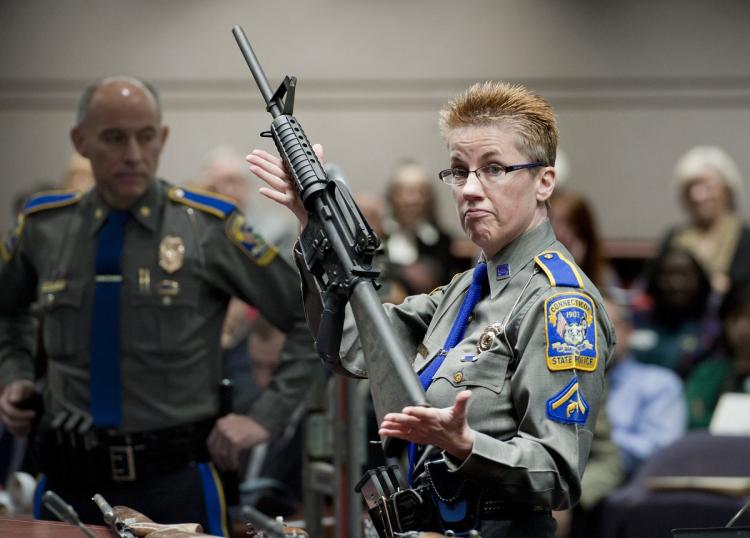 The American Medical Association has said that gun violence in the U.S. is a'public health crisis. Above Connecticut State Polic ehold up an AR-15 the same gun used by Newtown shooter Adam Lanza