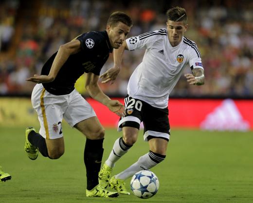 HEINO KALIS  REUTERSIn the first leg of their UEFA Champions League match Fabinho of AS Monaco battles Rodrigo De Paul of Valencia for possession