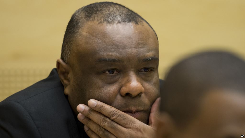 FILE- Former Congo vice-president Jean Pierre Bemba looks up at his trial at the International Criminal Court in The Hague Netherlands Sept. 29 2015