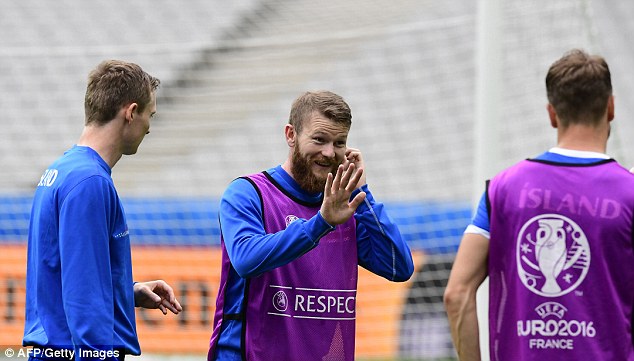 Iceland's midfielder and captain Aron Gunnarsson gestures to a team-mate on Tuesday