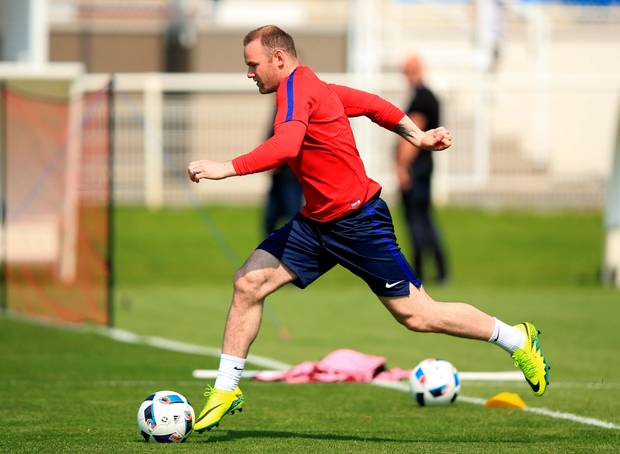 In at the deep end Wayne Rooney will be playing in a deep lying midfield
position for England for the first time in their opening clash against Russia