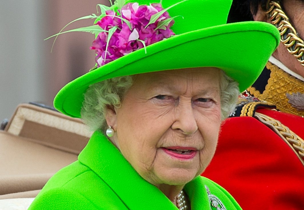 Queen Elizabeth II sits in a carriage during the Trooping the Colour this year marking the Queen's 90th birthday at The Mall