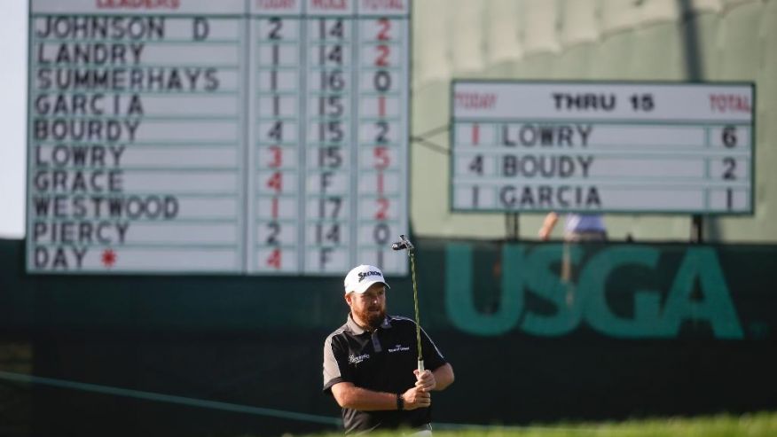 Shane Lowry of Republic of Ireland watches his putt on the 16th hole during the delayed third round of the U.S. Open golf championship at Oakmont Country Club on Sunday