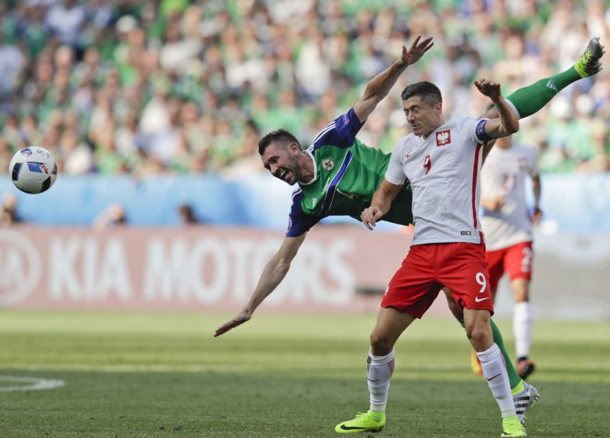 Northern Ireland's Gareth Mcauley top challenges Poland's Robert