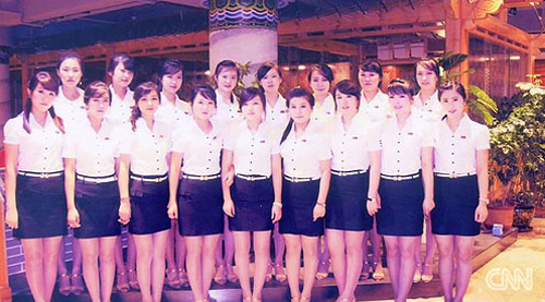 North Korean staff of a restaurant in China who recently defected to Korea pose for a group