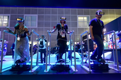 People'skateboard while sampling Samsung's Gear VR headsets powered by Oculus at E3