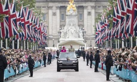 Some 10,000 people greeted Queen Elizabeth II and Prince Philip in London Sunday during a street fair in her honor