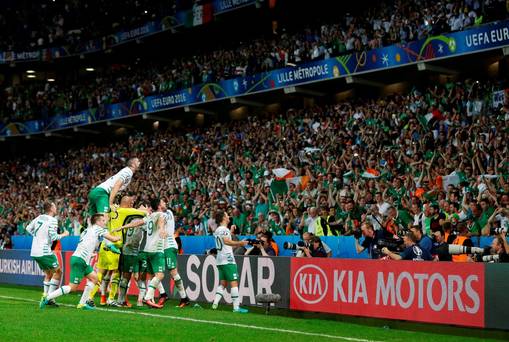 Republic of Ireland players celebrate with the fans