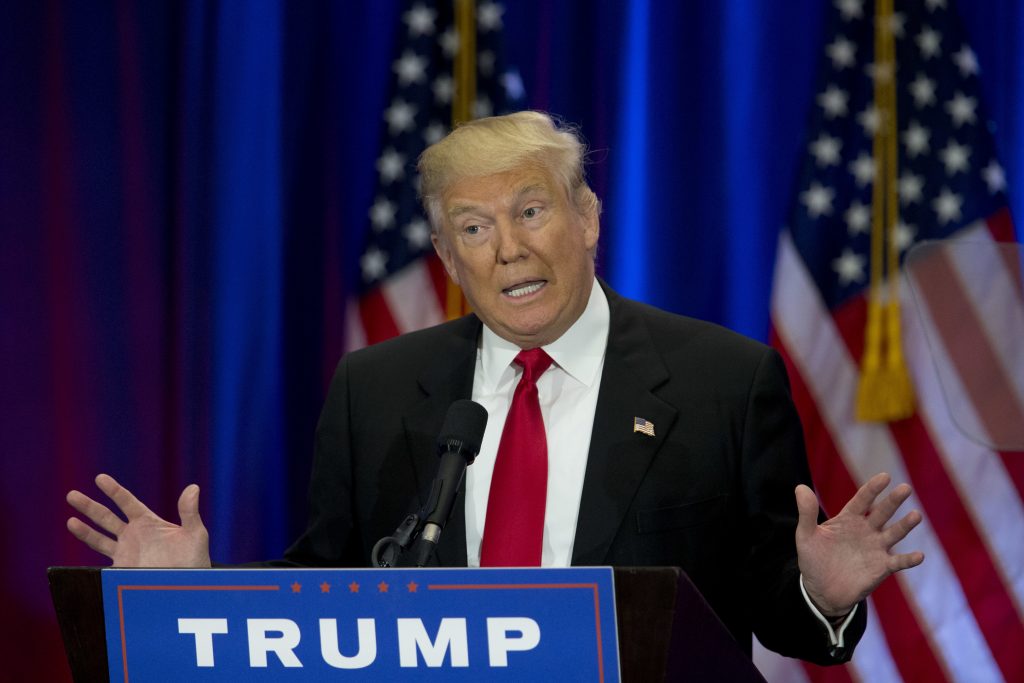 Republican presidential candidate Donald Trump gestures during a rally in Richmond Va. Friday