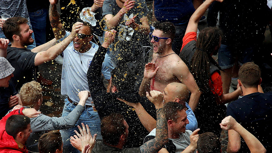 Reuters              Exuberant England fans celebrate outside a pub in the city center of Lille