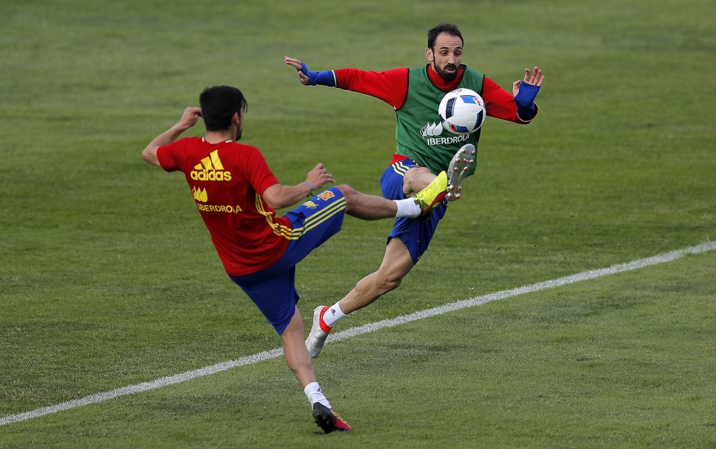 Spain's Nolito left duels for the ball with Juanfran during a training session at the Sports Complex Marcel Gaillard in Saint Martin de Re in France Sunday