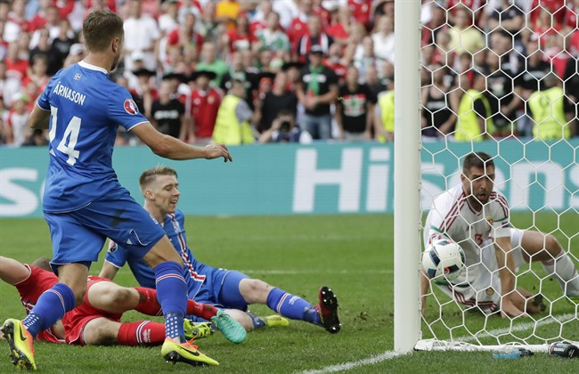 Iceland's Birkir Saevarsson center scores an own goal during the Euro 2016 Group F soccer match between Iceland and Hungary at the Velodrome stadium in Marseille France Saturday