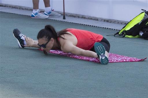 Russia's pole vaulter Yelena Isinbayeva warms up during a training session prior to the National track and field championships at a stadium in Cheboksary Russia Sunday