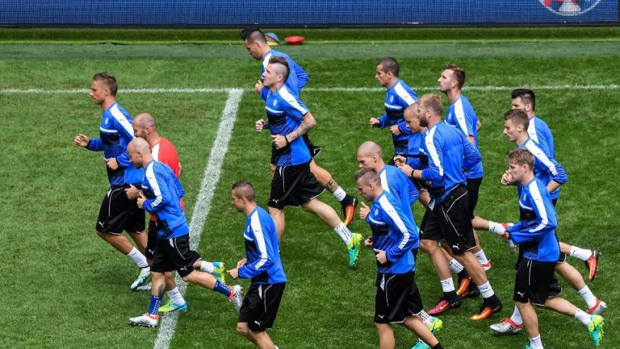 Slovakia's soccer players warm up during a training session at the Pierre Mauroy stadium in Villeneuve d’Ascq near Lille France Tuesday