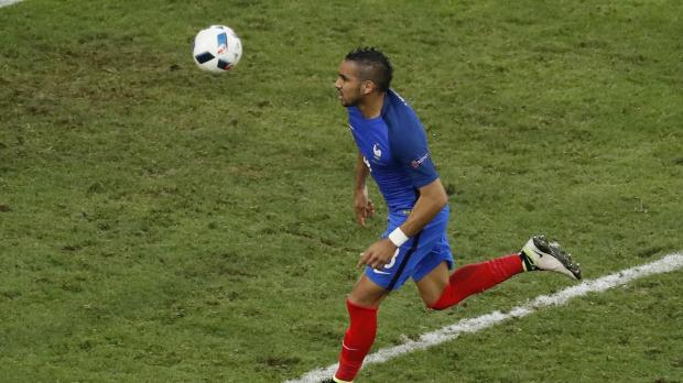 Payet chases a ball during France's game against Albania. French coach Didier Deschamps had harsh words about the state of the pitch