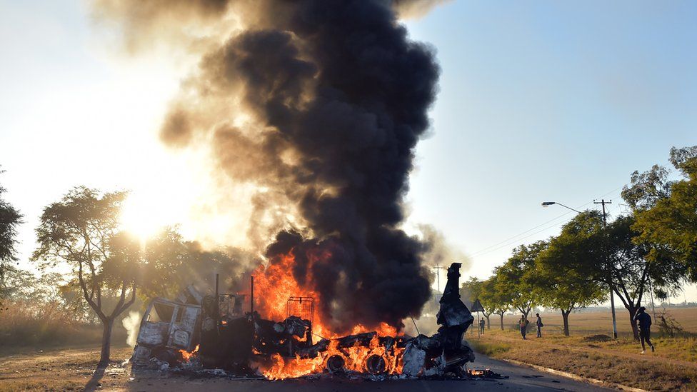 South Africa's capital Pretoria remains tense after clashes saw residents in townships around the city torching vehicles and looting