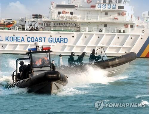 South Korean law enforcement boats practice intercepting Chinese fishing boats near Yeonpyeong Island in the Yellow Sea