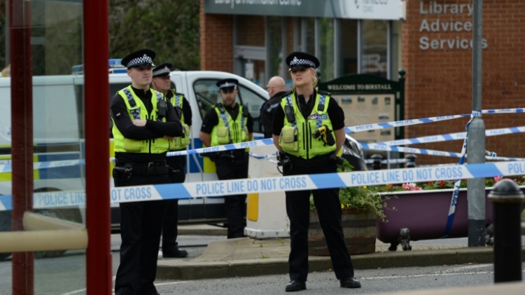 Policemen stand guard in Birstall where the pro European British MP Jo Cox was violently attacked