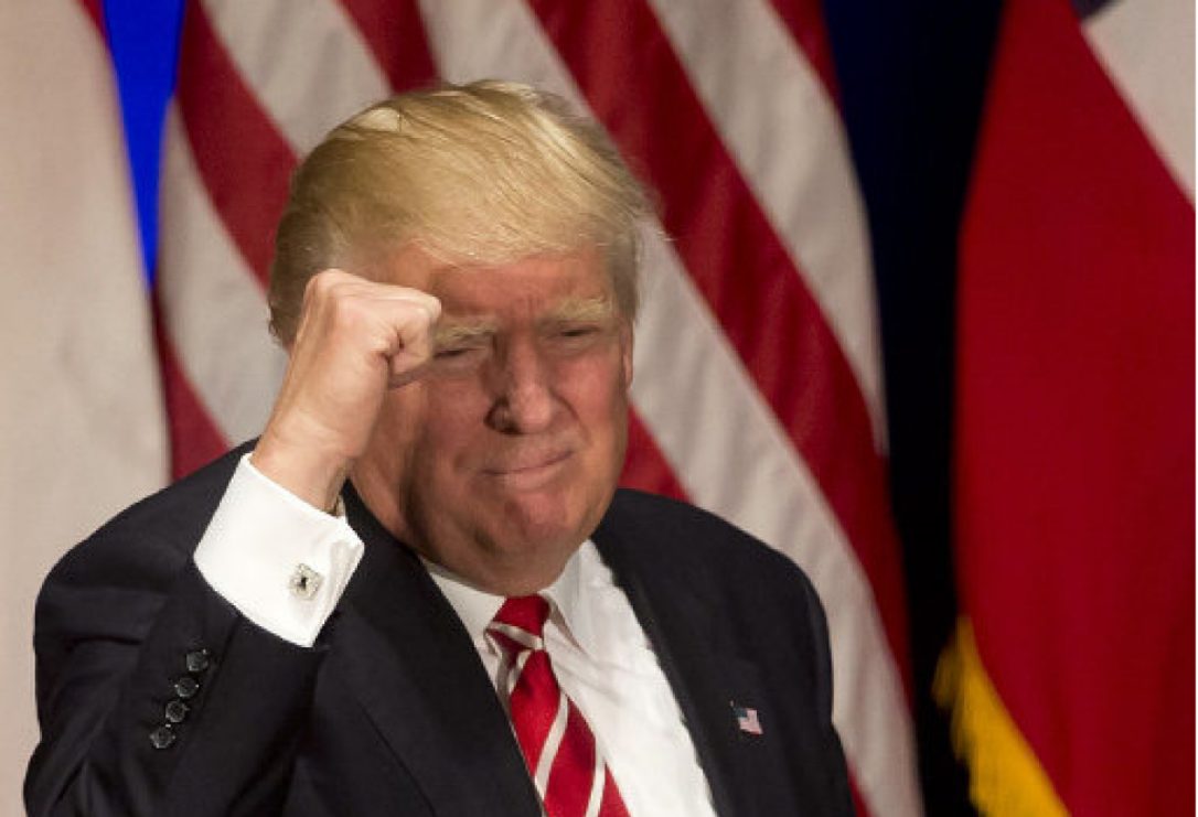 Republican presidential candidate Donald Trump pumps his fist after speaking at a rally in Atlanta on June 15