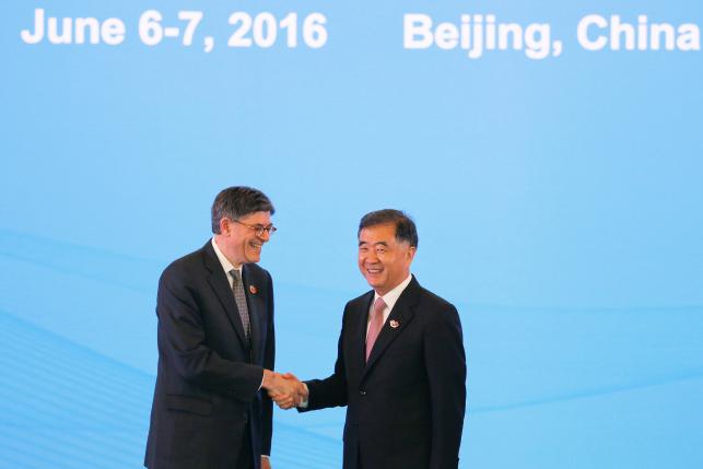 U.S. Treasury Secretary Jack Lew shakes hands with China's Vice Premier Wang Yang before the Economic Dialogue of the 8th round of U.S.-China Strategic and Economic Dialogues in Beijing