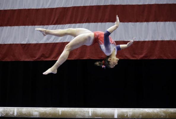 Maggie Nichols competes on the balance beam during