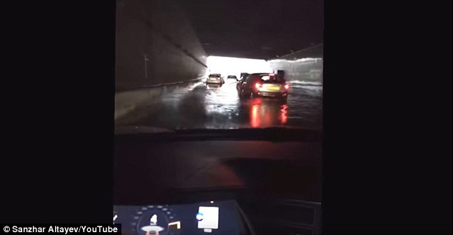 A video which was taken in Almaty the biggest metroplois in Kazakhstan shows a driver in a Model S stop inside a tunnel before proceeding to drive past two other cars. Tesla co-founder Elon Musk Tweeted about the Model S floating but was adamant he