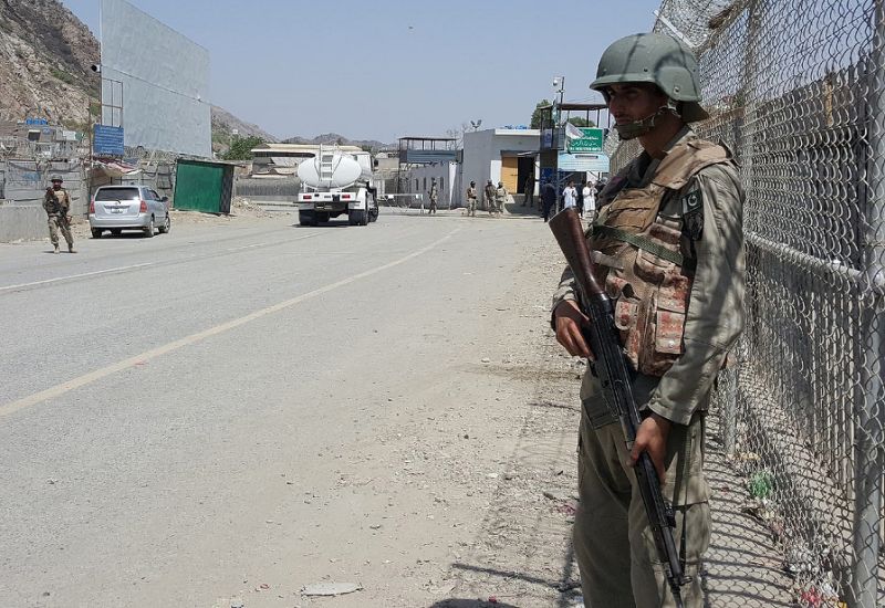 Pakistani soldiers patrol at the Torkham crossing between Pakistan and Afghanistan