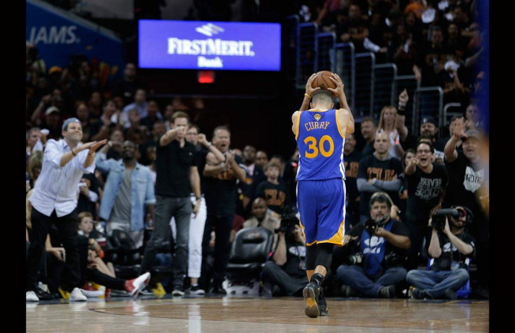 Golden State Warriors guard Stephen Curry reacts to being called for a foul against the Cleveland Cavaliers during the second half of Game 6 of basketball's NBA Finals in Cleveland Thursday