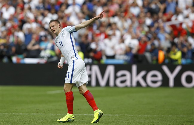 England's Jamie Vardy celebrates after scoring his side’s first goal during the Euro 2016 Group B soccer match between England and Wales at the Bollaert stadium in Lens France Thursday