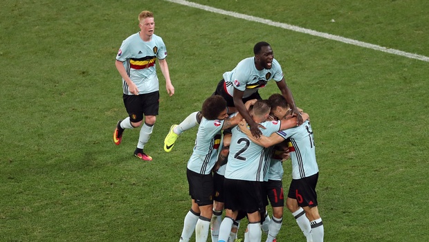 Belgian players celebrate after Radja Nainggolan scored the opening goal during the Euro 2016 Group E soccer match between Sweden and Belgium at the Allianz Riviera stadium in Nice France Wednesday