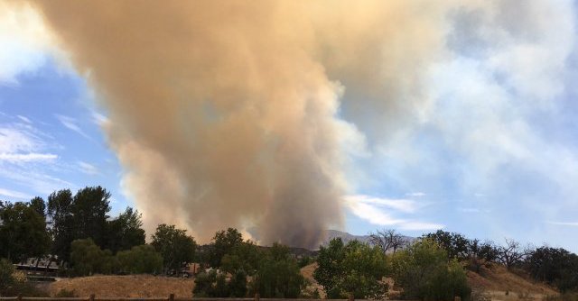 A fast-moving brush fire north of Los Angeles has forced the evacuation of some 250 homes