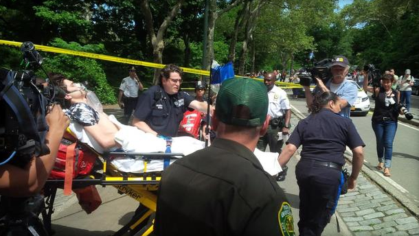 A man is carted away by emergency workers after an explosion in Central Park in New York City