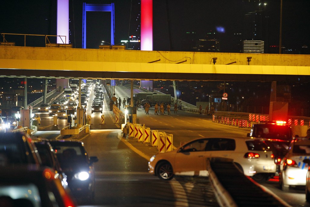 AP Turkish soldiers block Istanbul's Bosphorus Bridge lit in the colors of the French flag