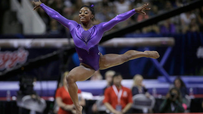 APSimone Biles competes on the floor exercise during the women's U.S. Olympic gymnastics trials in San Jose Calif. Friday