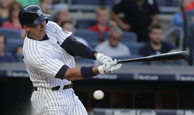 New York Yankees designated hitter Alex Rodriguez swings and misses during his first at-bat during the second inning of a baseball game Friday