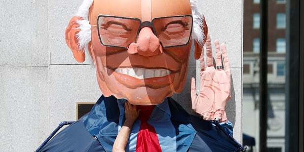 Alex Schaefer a supporter of Senator Bernie Sanders puts on a Bernie costume for a demonstration at Dillworth Park in Philadelphia