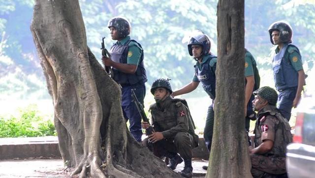 Army soldiers take their positions near the Holey Artisan restaurant after Islamist militants attacked the upscale cafe in Dhaka Bangladesh