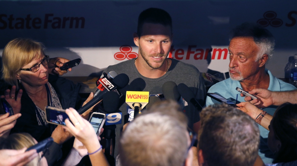 Chicago White Sox starting pitcher Chris Sale talks to reporters in the dugout after the White Sox's 3-1 loss to the Chicago Cubs in a baseball game Thursday