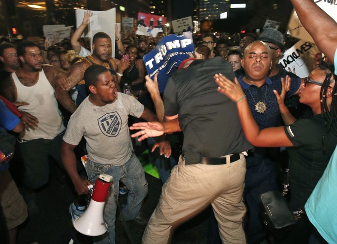 The Latest: Protesters gather outside police headquarters