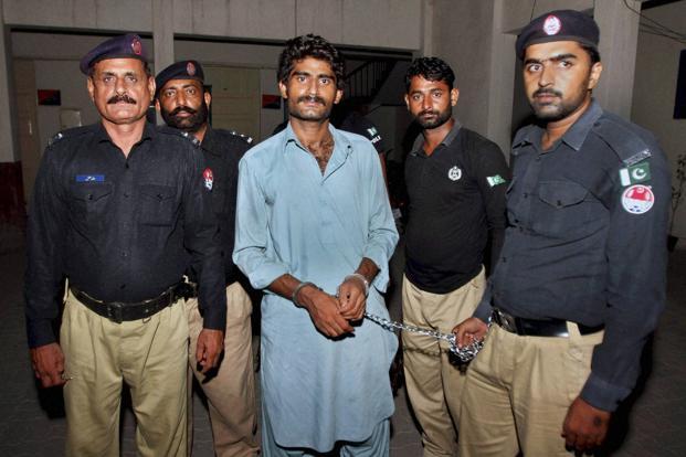 Pakistani police officers present Waseem Azeem the brother of slain model Qandeel Baloch before the media following his arrest at a police station in Multan Pakistan on Sunday