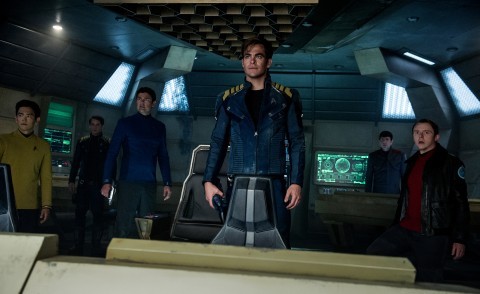 Captain Kirk, center and the crew of the starship Enterprise face a new villain in “Star Trek Beyond.”