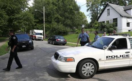 Kansas City Kan. and Shawnee police officers worked part of the shooting scene of a police officer in Kansas City Kan. on Tuesday