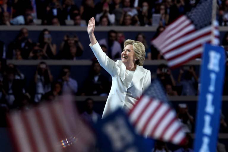 Democratic presidential candidate Hillary Clinton acknowledges the crowd as she arrives on stage during the fourth day of the Democratic National Convention at the Wells Fargo Center