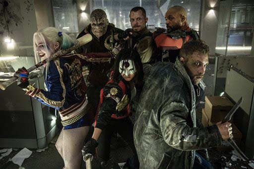 In this image released by Warner Bros. Entertainment cast members clockwise from left Margot Robbie Adewale Akinnuoye-Agbaje Joel Kinnaman Will Smith Jai Courtney and Karen Fukuhara appear in the film'Suicide Squad. (Clay Enos  Warner Bros. Enter