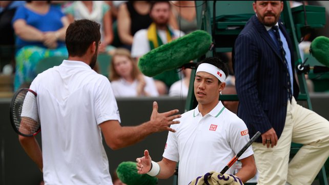 A dejected Kei Nishikori congratulates Marin Cilic after retiring